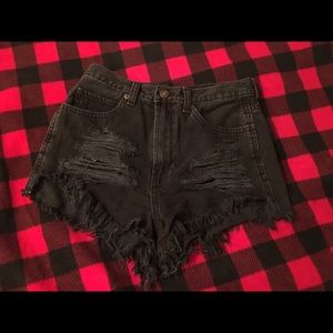 High-waisted, distressed black shorts
